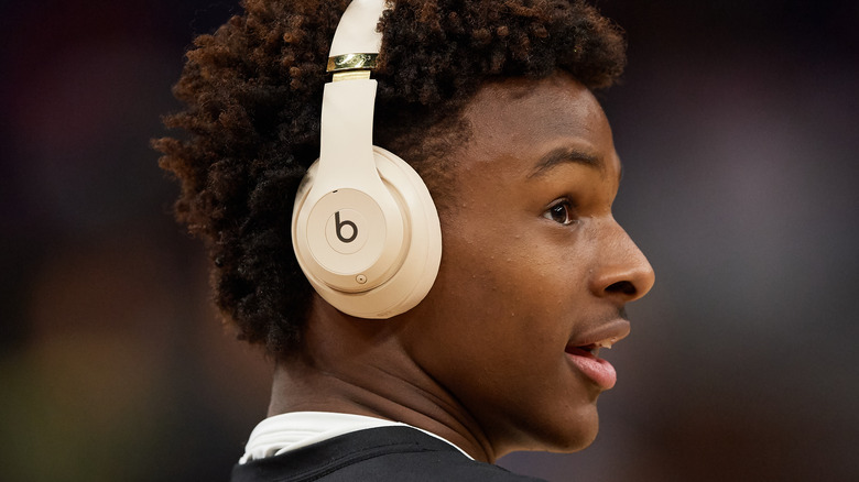 Bronny James wearing headphones