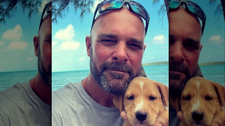 Bryan Baeumler holding a puppy 