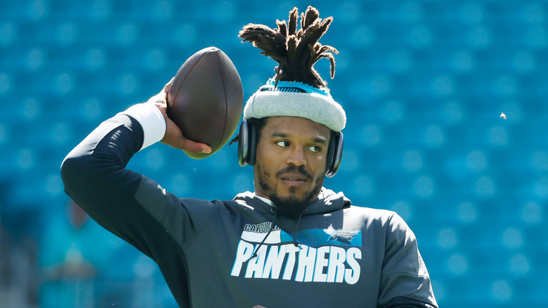 Cam Newton holding football 