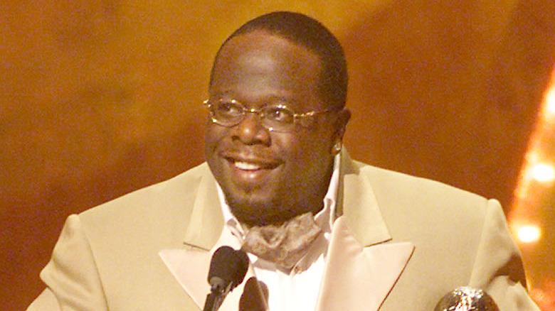 Cedric the Entertainer on stage, smiling