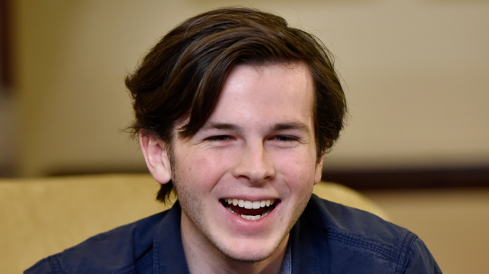 Chandler Riggs laughing leaning forward