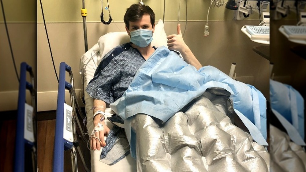 Chandler Riggs in hospital giving thumbs up