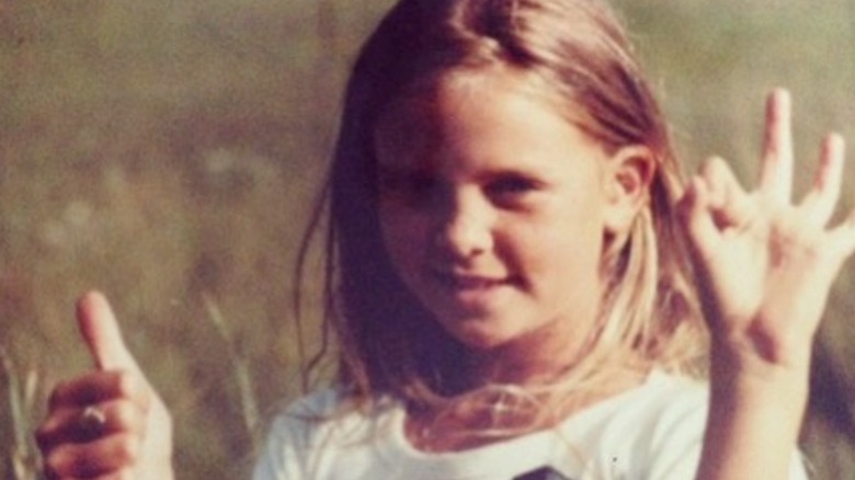 Charlize Theron playing as a child