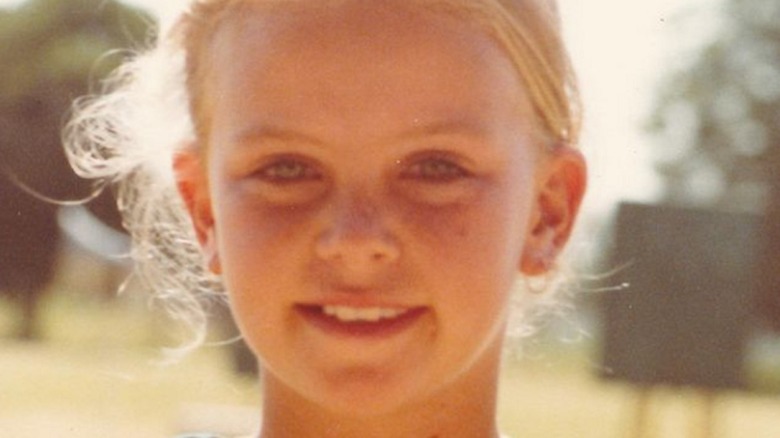 Charlize Theron as a child, smiling