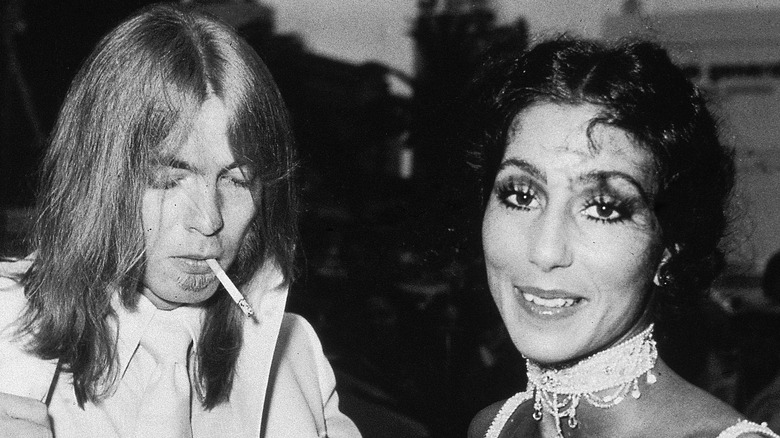 Gregg Allman smoking, Cher smiling