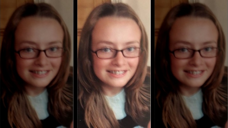 Amelia Dimoldenberg smiling as a teenager with braces and glasses