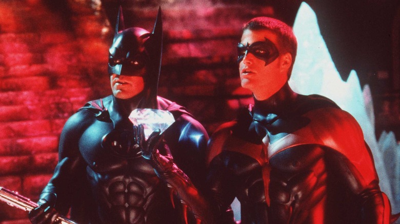 Batman and Robin holding crystal