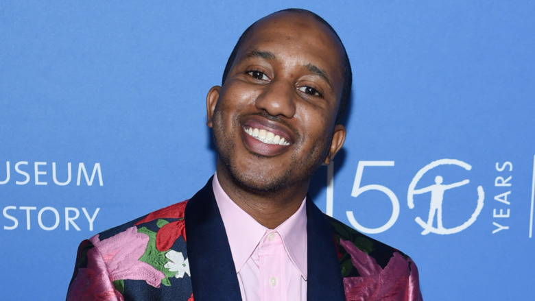 Chris Redd smiling in floral suit