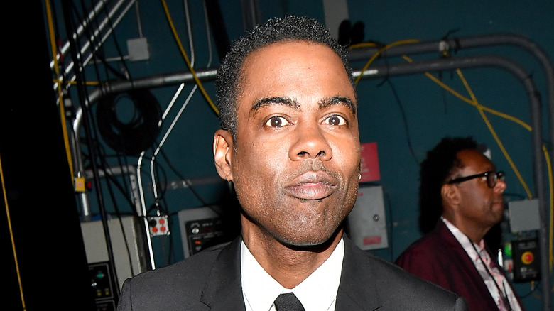 Chris Rock in a black suit