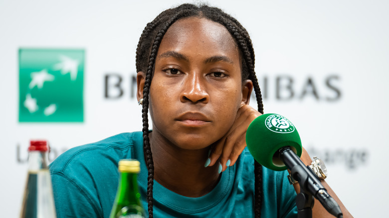 Coco Gauff sitting in front of microphone