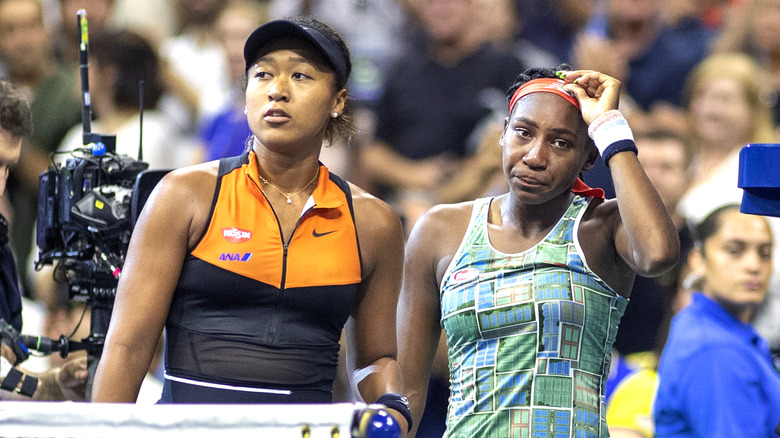 Coco Gauff crying standing next to Naomi Osaka