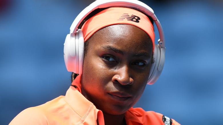 Coco Gauff wearing white headphones