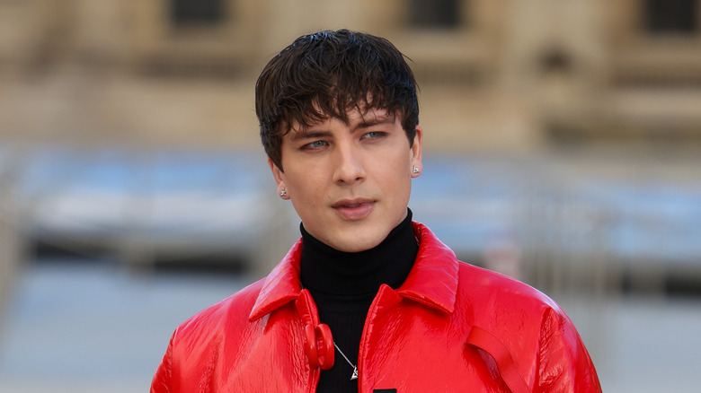 Cody Fern wearing red jacket