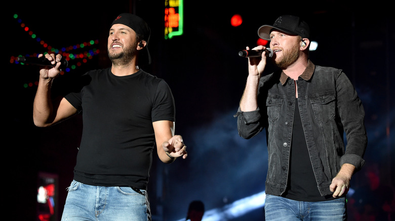 Luke Bryan and Cole Swindell on stage