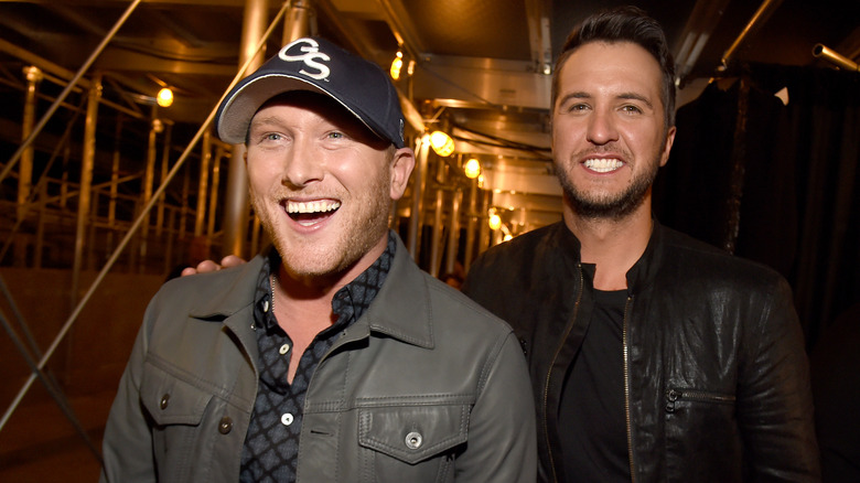 Cole Swindell and Luke Bryan posing