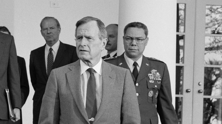 President George H.W. Bush and Colin Powell walking