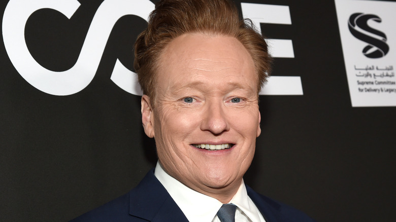 Conan O'Brien in a navy suit