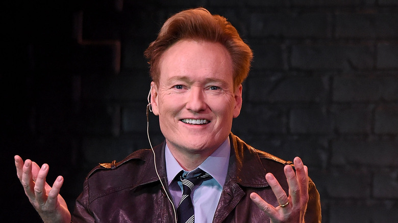 Conan O'Brien in a leather jacket