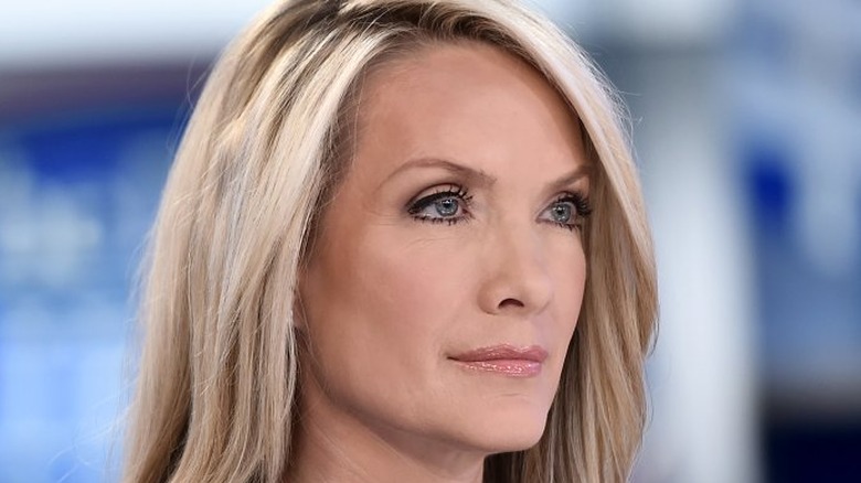 Dana Perino looking off to the side