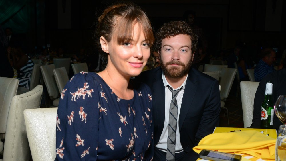 Bijou Phillips and Danny Masterson sitting