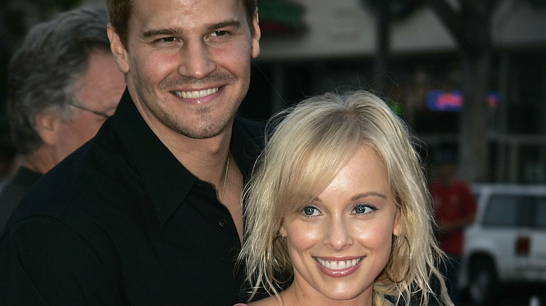 Young David Boreanaz and Jaime Bergman smiling 