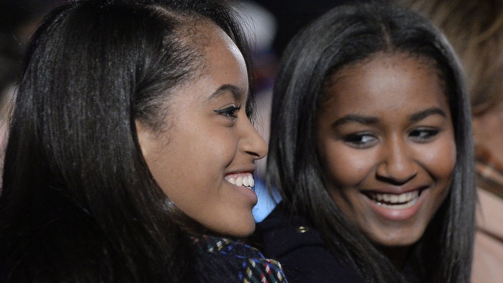 Malia Obama and Sasha Obama at the national Christmas tree lighting ceremony in 2015