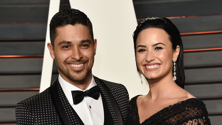 Wilmer Valdrrama and Demi Lovato posing together