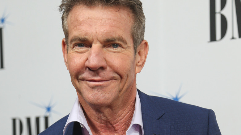 Dennis Quaid slight smile in blue sport coat