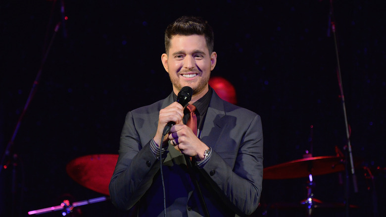 Michael Buble holding a mic