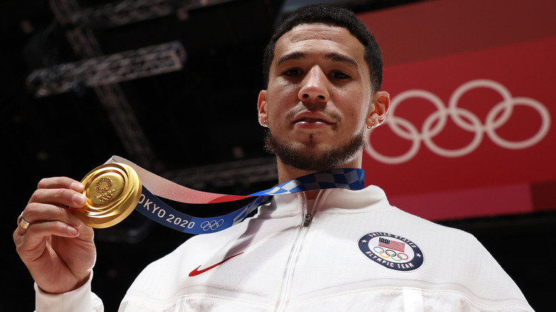Devin Booker, posing with his gold medal