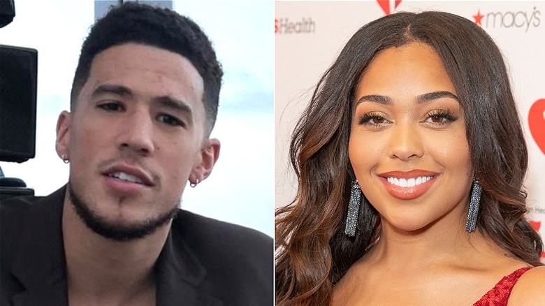 Devin Booker smiling, left, Jordyn Woods smiling, right