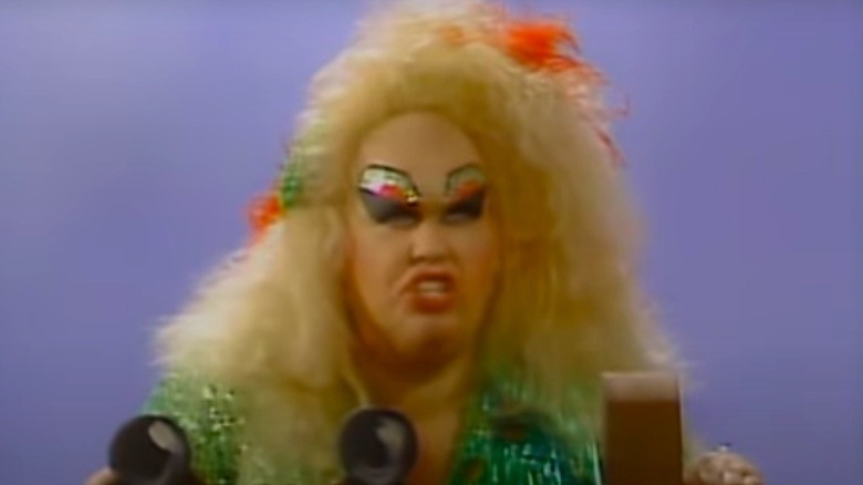 John Candy as Divine in SCTV