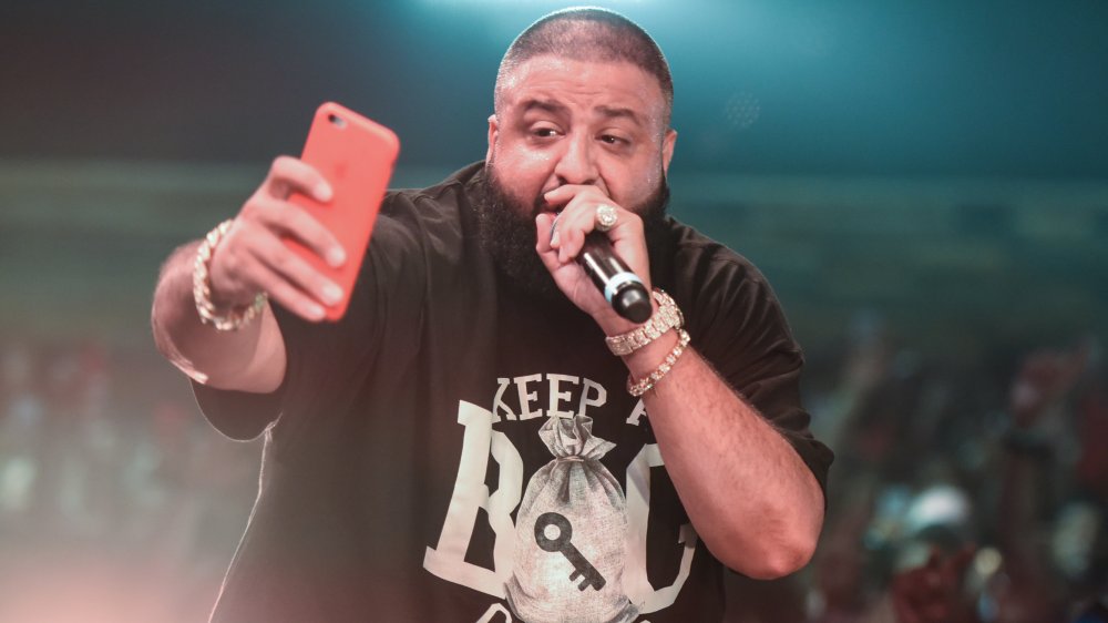 DJ Khaled selfieing while on stage