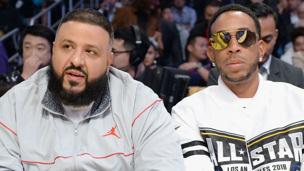 DJ Khaled and Ludacris watching a basketball game