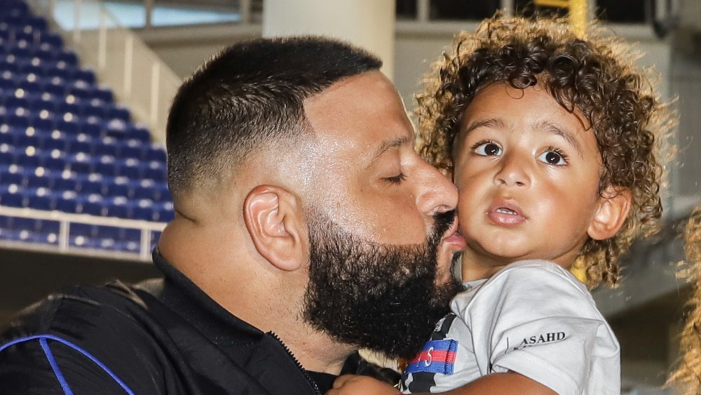 DJ Khaled kissing his son, Asahd, on the cheek