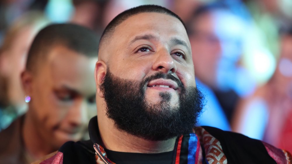 DJ Khaled smiling and looking up