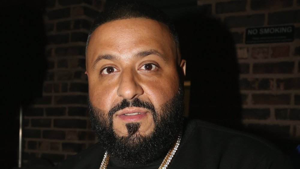 DJ Khaled in black shirt and bling around his neck