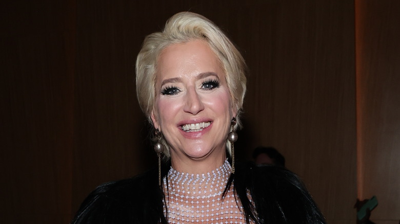 Dorinda Medley with long earrings, smiling