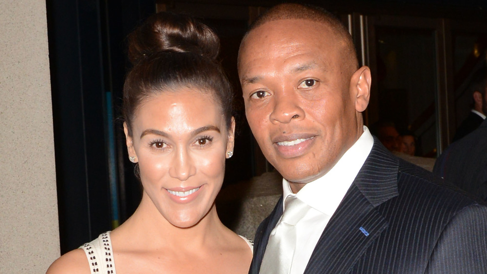 Nicole Young smiles with Dr. Dre