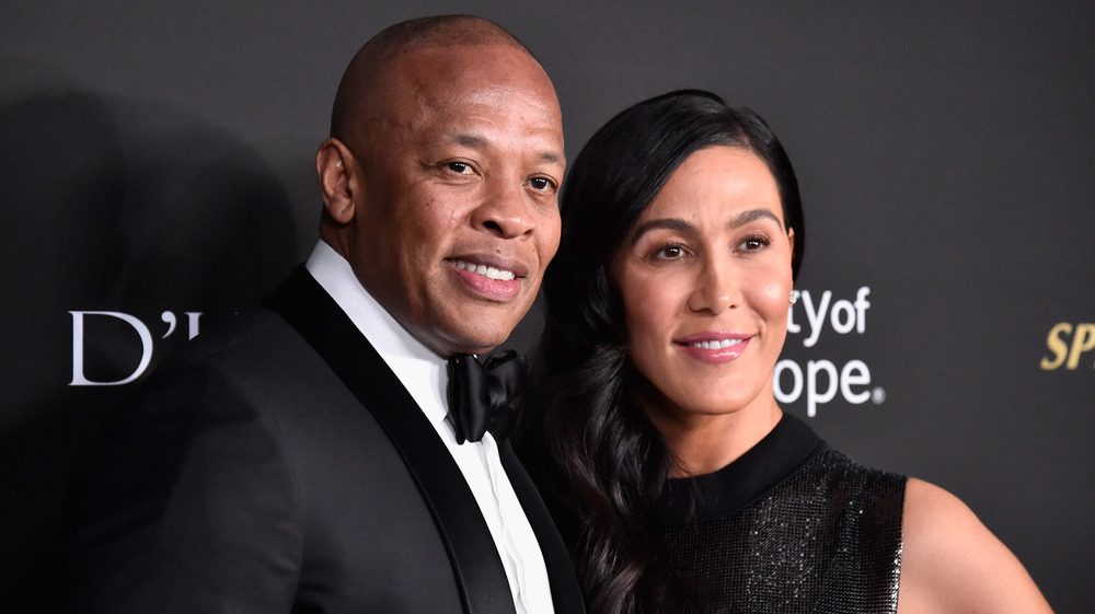 Dr. Dre smiles with Nicole Young