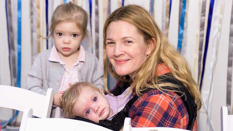 Drew Barrymore smiling with her children