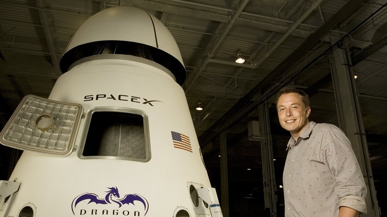 Elon Musk next to a rocket