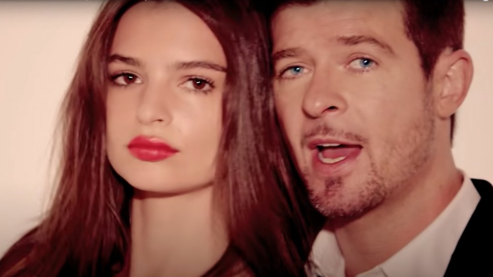 Emily Ratajkowski and Robin Thicke in the Blurred Lines music video