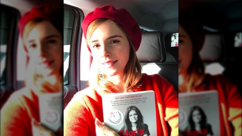 Emma Watson holding a book