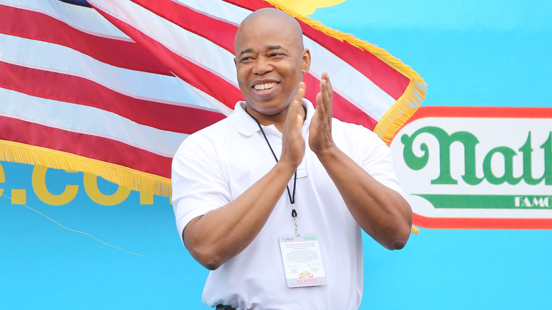 Eric Adams at a hot dog eating competition