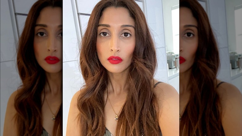 Anisha, red lipstick selfie, not smiling 