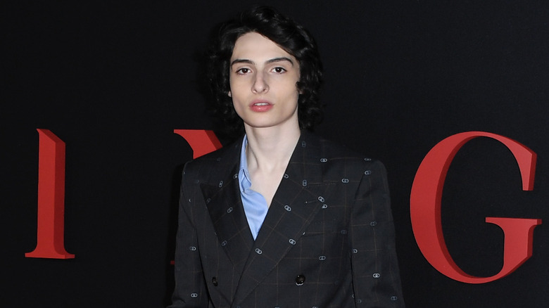 Finn Wolfhard posing at premiere