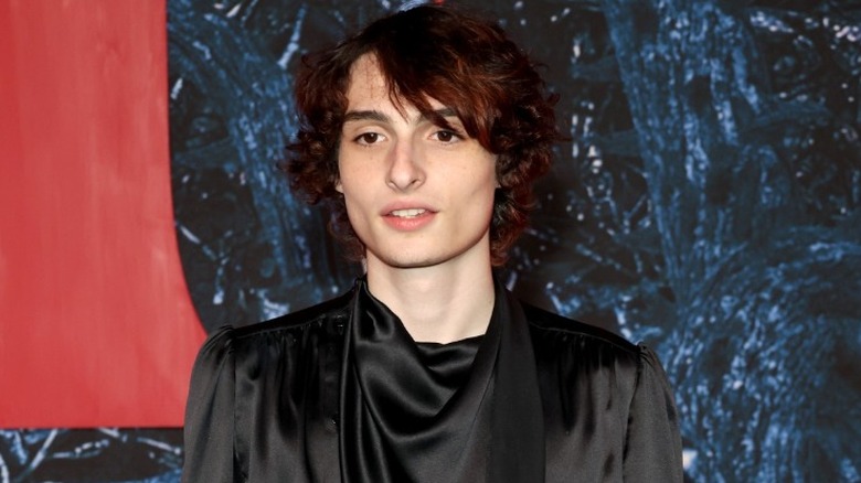 Finn Wolfhard posing at event 