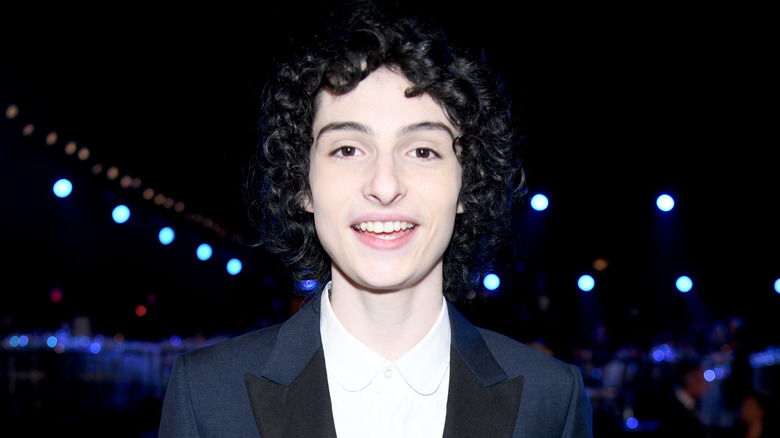 Finn Wolfhard smiling at awards