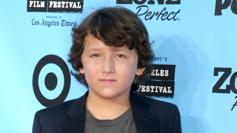 Young Frankie Jonas posing on red carpet